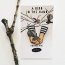 A Bird in the Hand Enamel Pin