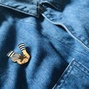 A Bird in the Hand Enamel Pin