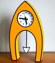 Lge Cartoon Clock Pointed Orange w Pend