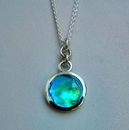 Small Paua Disc Pendant Rings Top